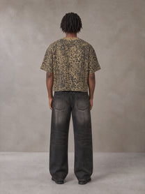 Model wearing the SM Leopard Print Boxy T-shirt in Muesli, rear view.