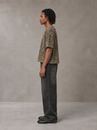 Model wearing the SM Leopard Print Boxy T-shirt in Muesli, side profile.