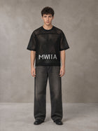 Model wearing the SM Mesh Boxy T-shirt in Midnight Black, front view.