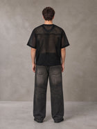 Model wearing the SM Mesh Boxy T-shirt in Midnight Black, rear view.