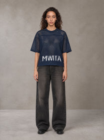 Model wearing the SM Mesh Boxy T-shirt in Oxford Navy, front view.