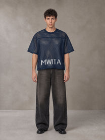 Model wearing the SM Mesh Boxy T-shirt in Oxford Navy, front view.