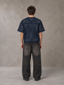 Model wearing the SM Mesh Boxy T-shirt in Oxford Navy, rear view.