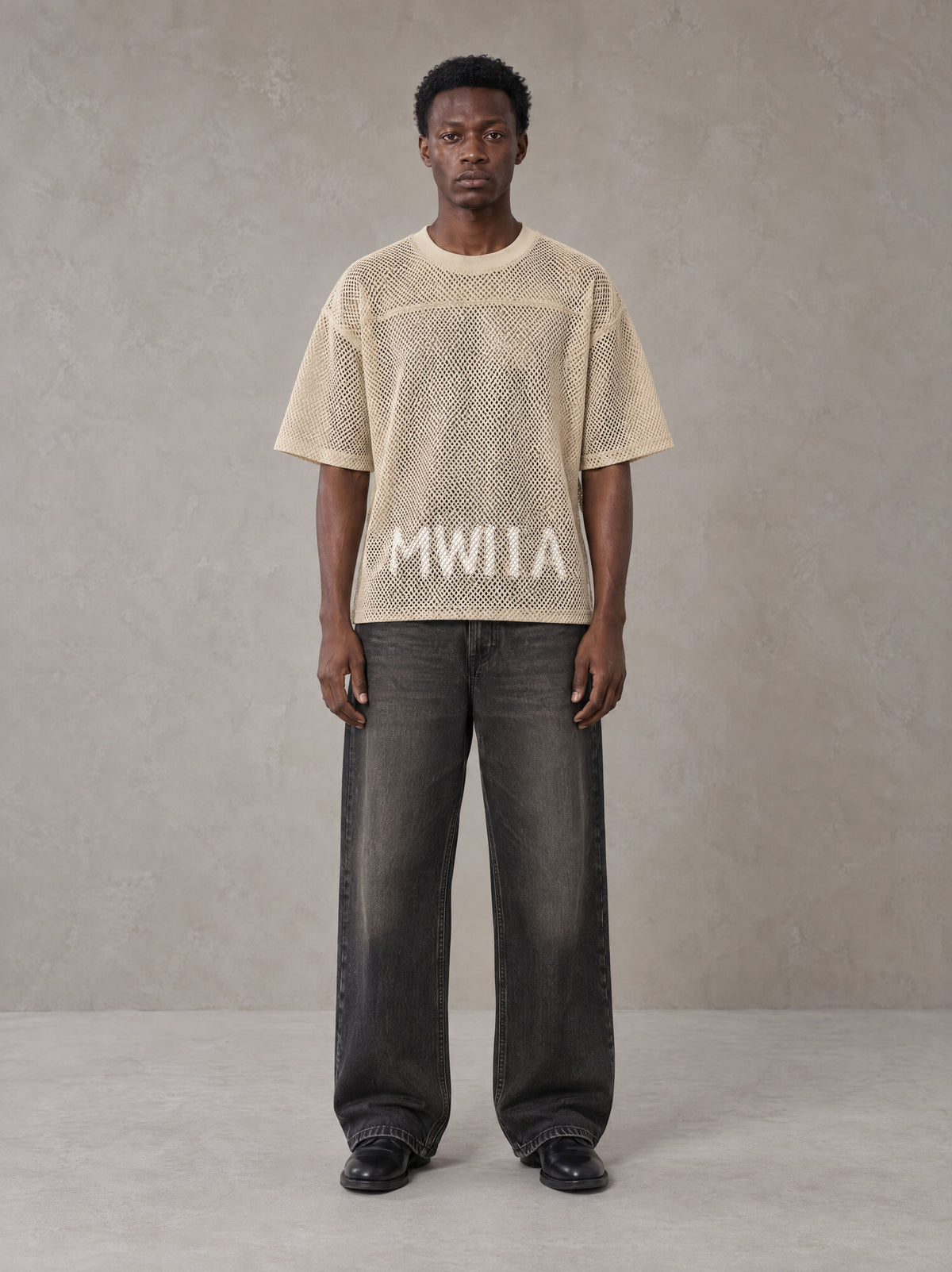 Model wearing the SM Mesh Boxy T-shirt in Soft Beige, front view.
