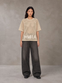 Model wearing the SM Mesh Boxy T-shirt in Soft Beige, front view.