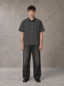 Model wearing the SM Pinstripe Short Sleeve Shirt in Deep Charcoal, front view.
