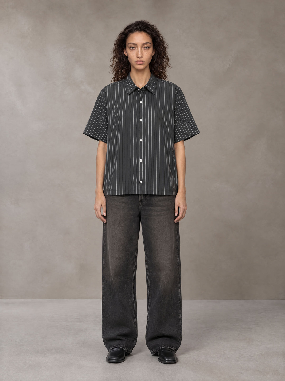 Model wearing the SM Pinstripe Short Sleeve Shirt in Deep Charcoal, front view.