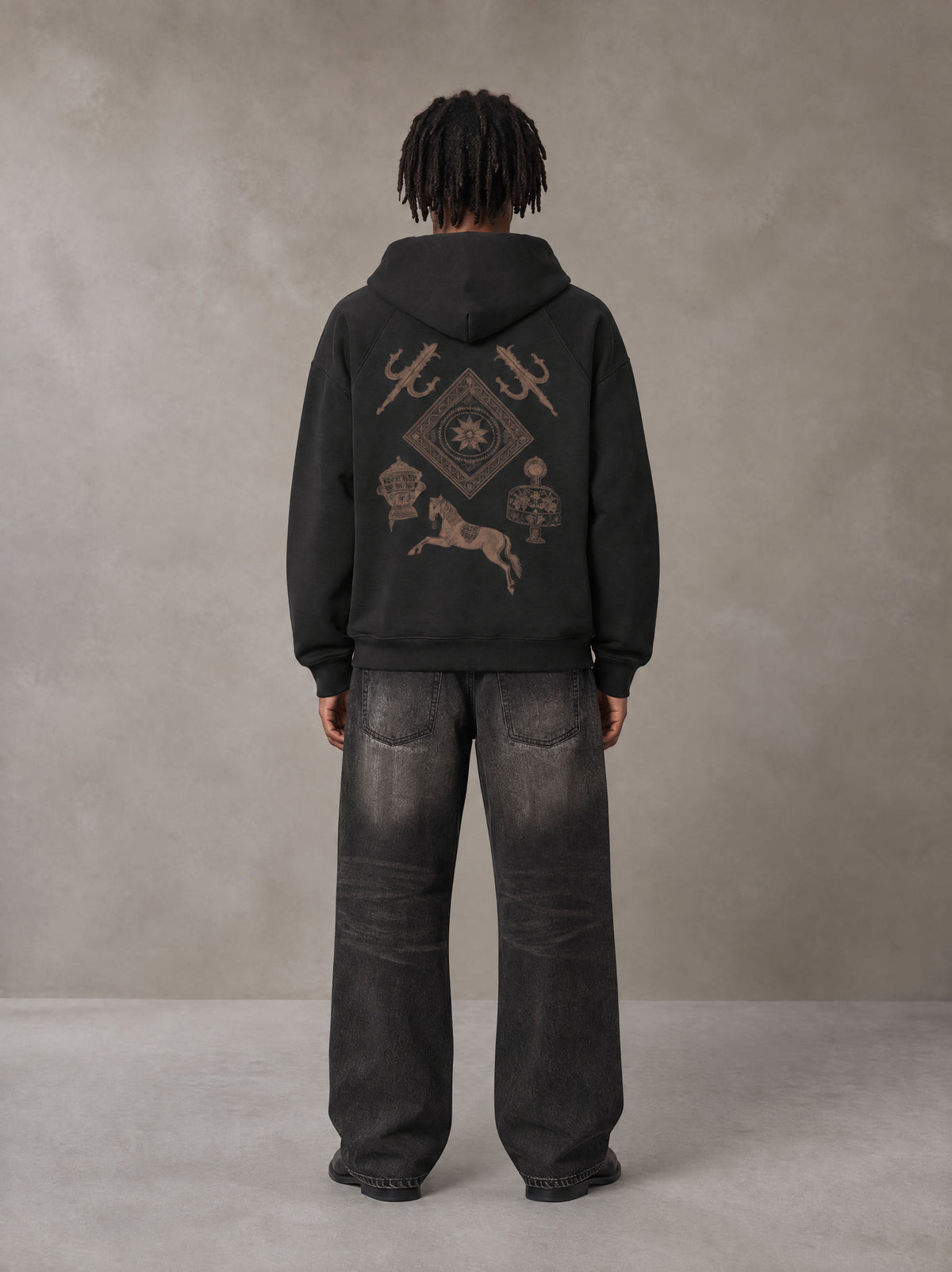 Model wearing the SM Regal Hoodie in Midnight Black, rear view.