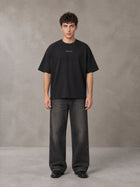 Model wearing the SM Regal T-shirt in Midnight Black, front view.