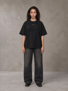 Model wearing the SM Regal T-shirt in Midnight Black, front view.