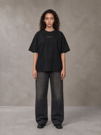 Model wearing the SM Regal T-shirt in Midnight Black, front view.