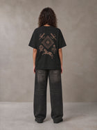 Model wearing the SM Regal T-shirt in Midnight Black, rear view.