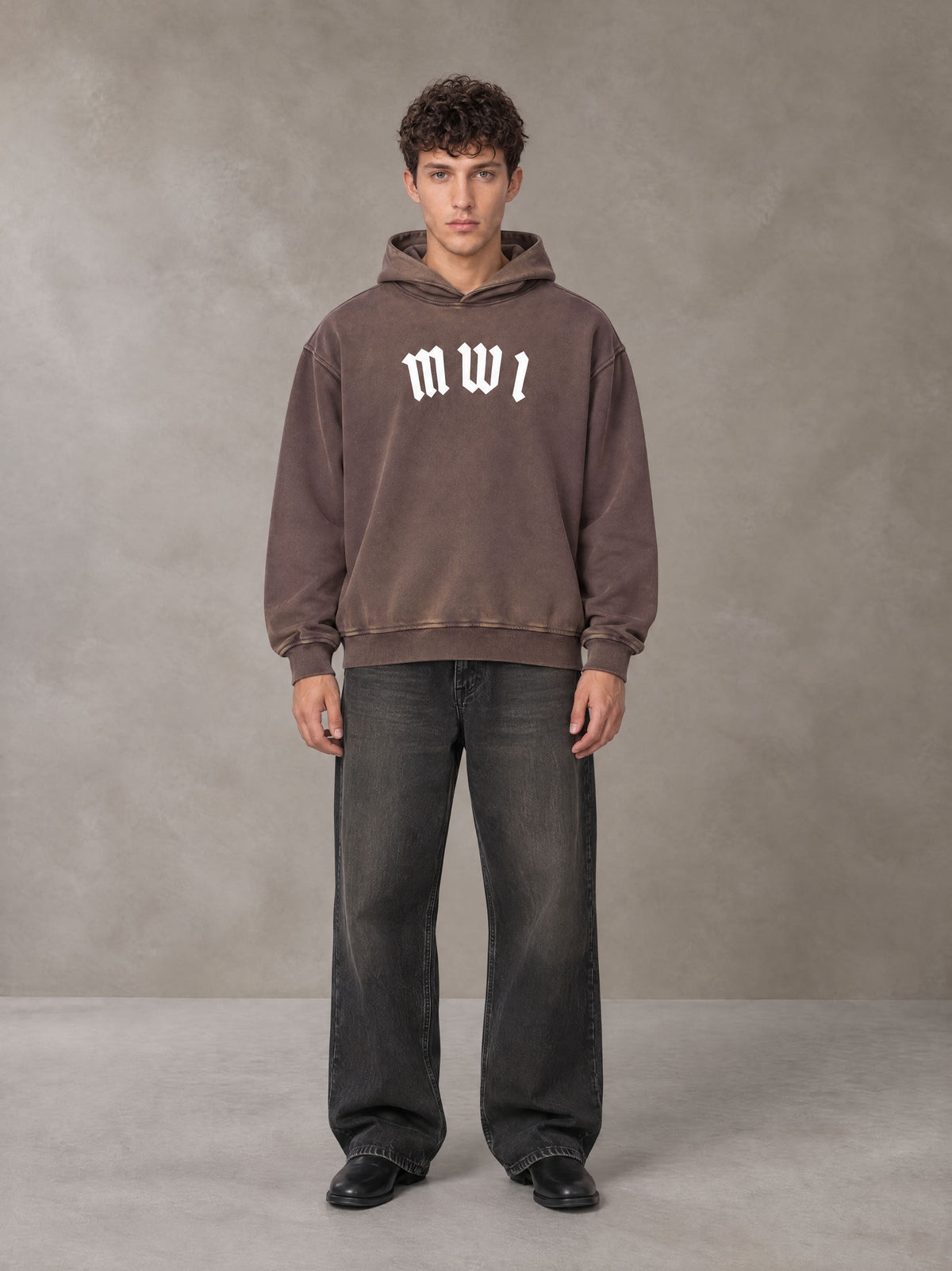 Model wearing the SM Script Washed Hoodie in Soft Taupe, front view.
