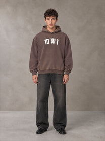 Model wearing the SM Script Washed Hoodie in Soft Taupe, front view.