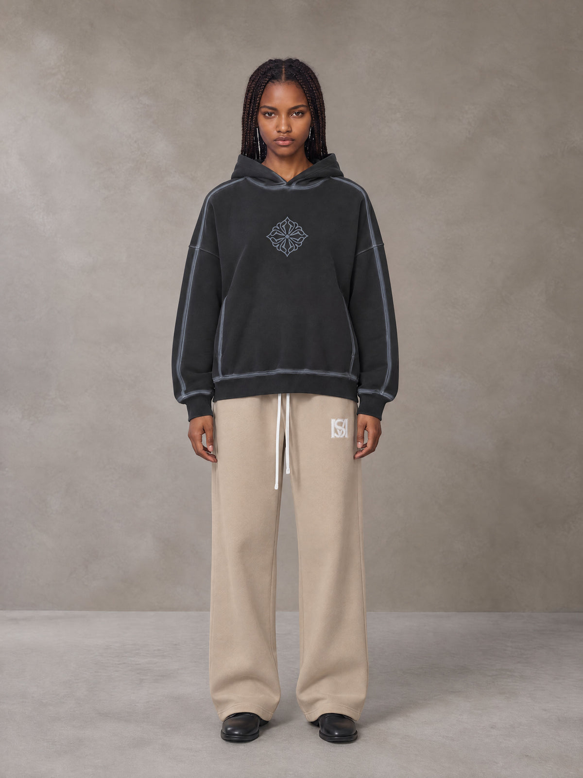 Model wearing the SM Fleece Straight Leg Trousers in Camel Tan, front view.
