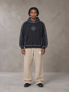 Model wearing the SM Fleece Straight Leg Trousers in Camel Tan, front view.