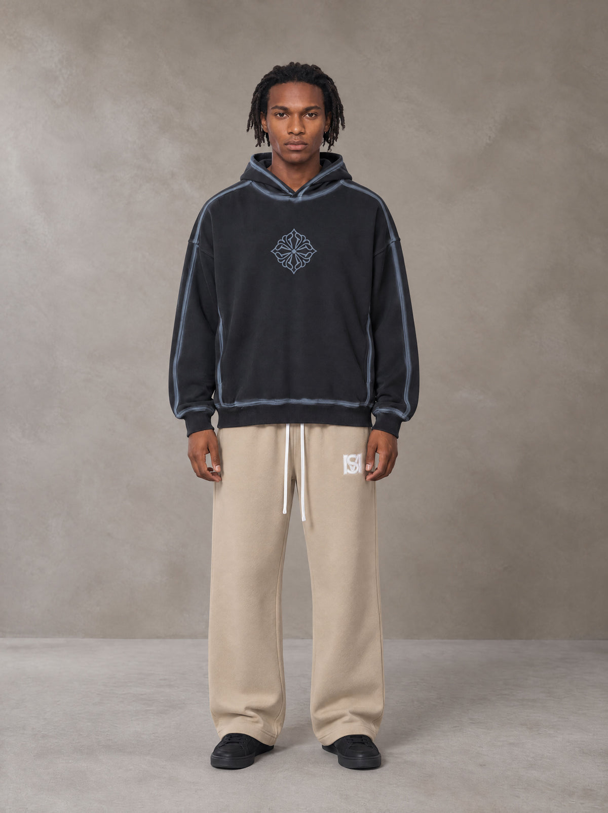 Model wearing the SM Fleece Straight Leg Trousers in Camel Tan, front view.