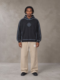Model wearing the SM Fleece Straight Leg Trousers in Camel Tan, front view.
