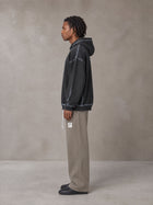 Model wearing the SM Fleece Straight Leg Trousers in Coffee Grey, side profile.