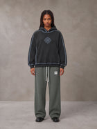 Model wearing the SM Fleece Straight Leg Trousers in Deep Charcoal, front view.