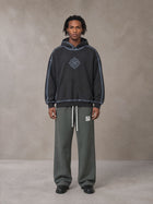 Model wearing the SM Fleece Straight Leg Trousers in Deep Charcoal, front view.