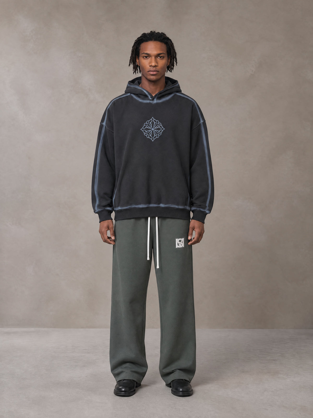 Model wearing the SM Fleece Straight Leg Trousers in Deep Charcoal, front view.