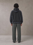 Model wearing the SM Fleece Straight Leg Trousers in Deep Charcoal, rear view.
