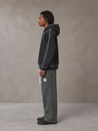 Model wearing the SM Fleece Straight Leg Trousers in Deep Charcoal, side profile.