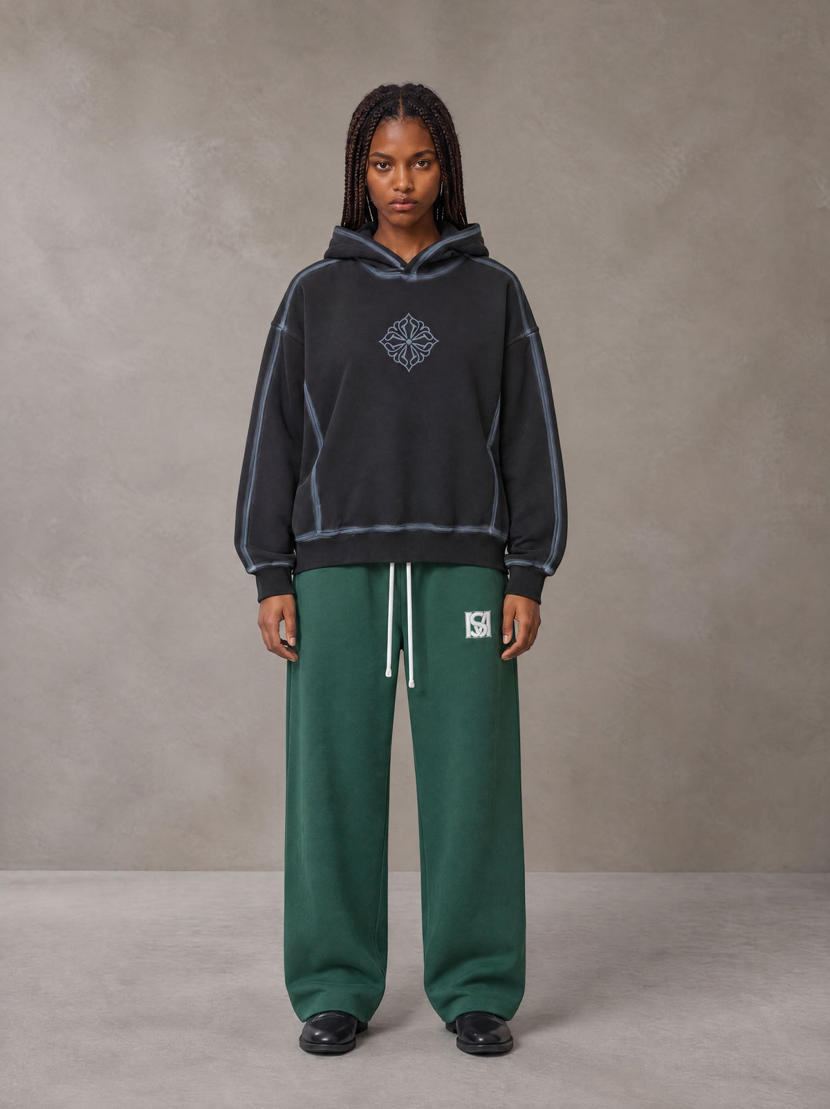Model wearing the SM Fleece Straight Leg Trousers in Eden Green, front view.