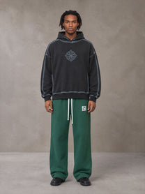 Model wearing the SM Fleece Straight Leg Trousers in Eden Green, front view.