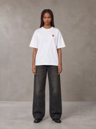 Model wearing the SM Sig. Oversized T-shirt in Lucent White, front view.