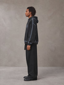 Model wearing SM Eternal Fleur Belted Trousers in Midnight Black, side profile.