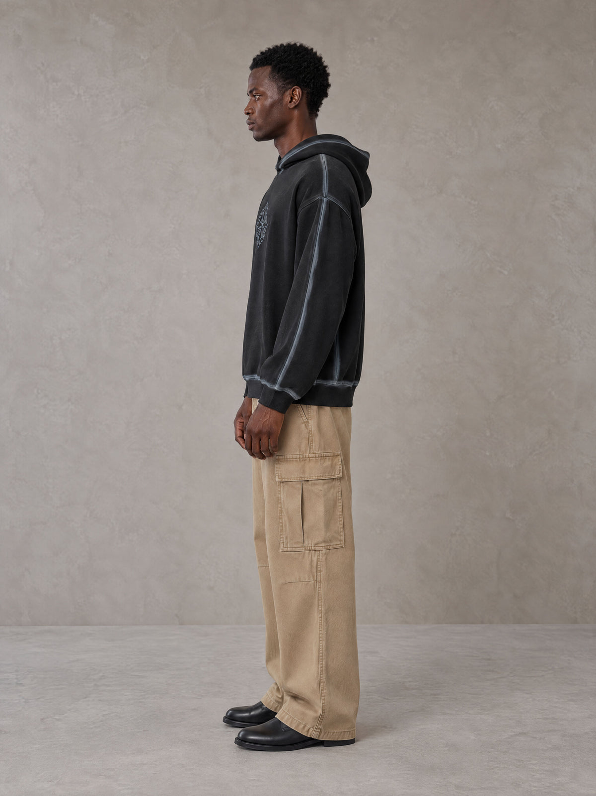 Model wearing SM Eternal Fleur Cargo Trousers in Camel Tan, side profile.