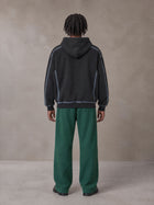 Model wearing SM Fleece Straight Leg Trousers in Eden Green, rear view.