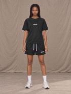 Model wearing the SM Motion Mesh T-shirt and SM Motion Mesh Shorts in black, front view.