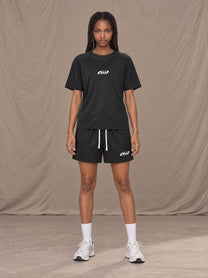 Model wearing the SM Motion Mesh T-shirt and SM Motion Mesh Shorts in black, front view.