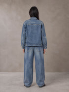 Model wearing the SM Vintage Wash Zip Denim Jacket and SM Heritage Wide Denim Jeans in Marble Blue, rear view.