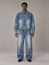 Model wearing the SM Vintage Wash Zip Denim Jacket and SM Heritage Wide Denim Jeans in Marble Blue, front view.