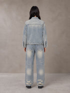 Model wearing the SM Vintage Wash Zip Denim Jacket and SM Heritage Distressed Denim Jeans in Cadet Grey, rear view.