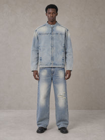 Model wearing the SM Vintage Wash Zip Denim Jacket and SM Heritage Distressed Denim Jeans in Cadet Grey, front view.