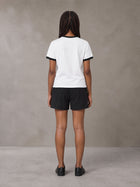 Model wearing the SM London T-shirt in Lucent White with the SM London Shorts in Midnight Black, rear view.