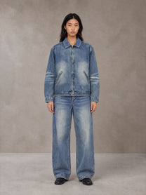 Model wearing the SM Vintage Wash Zip Denim Jacket and SM Heritage Wide Denim Jeans in Marble Blue, front view.