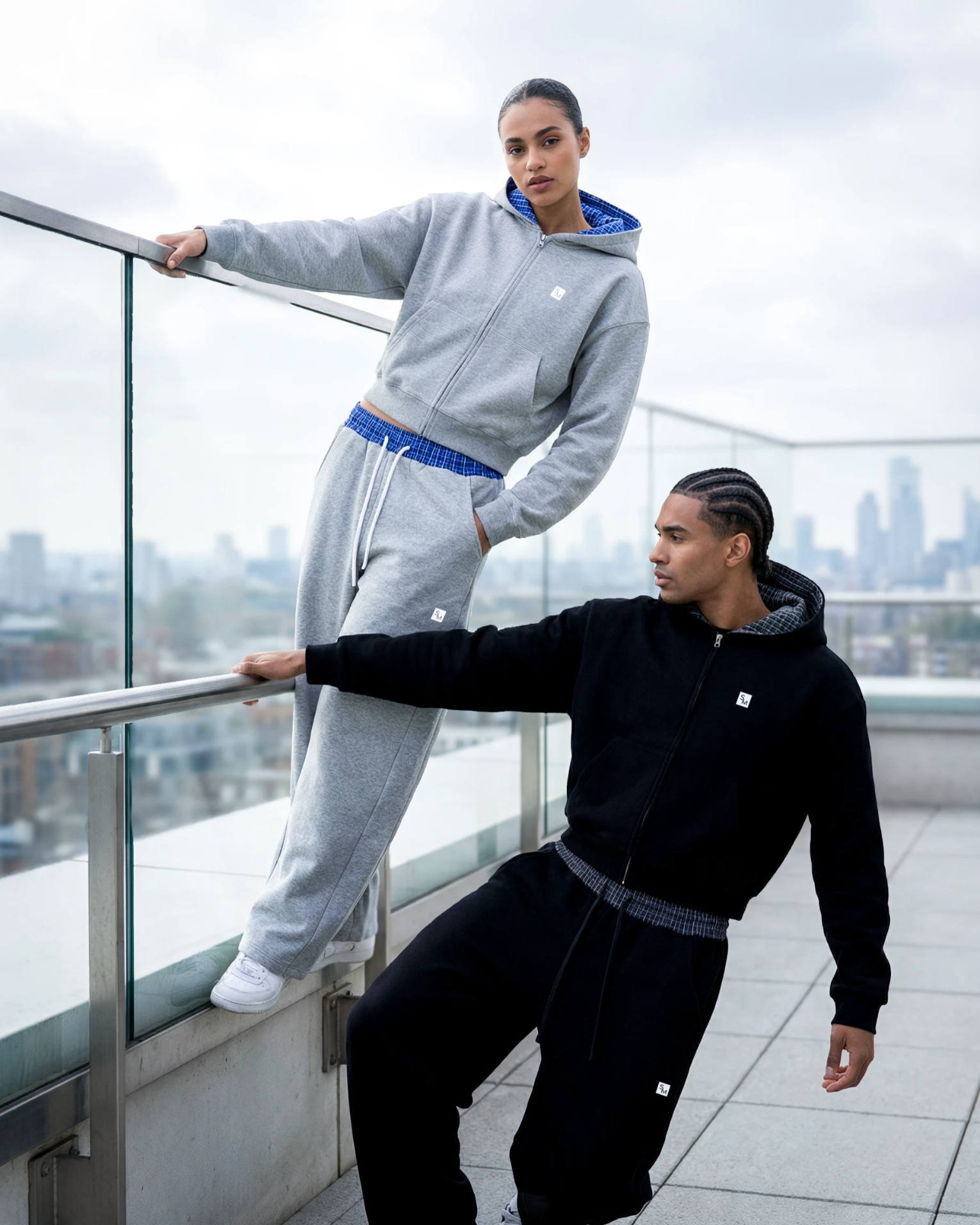 Two models wearing Plaid Hoodies and Sweatpants