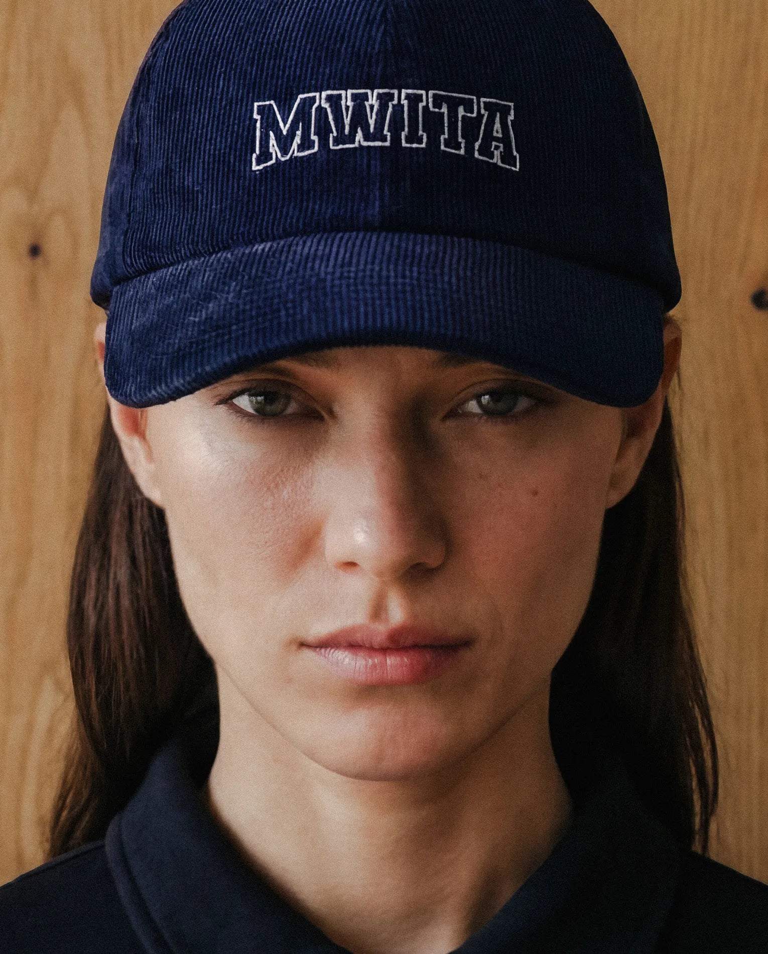 Model wearing SM Corduroy Cap