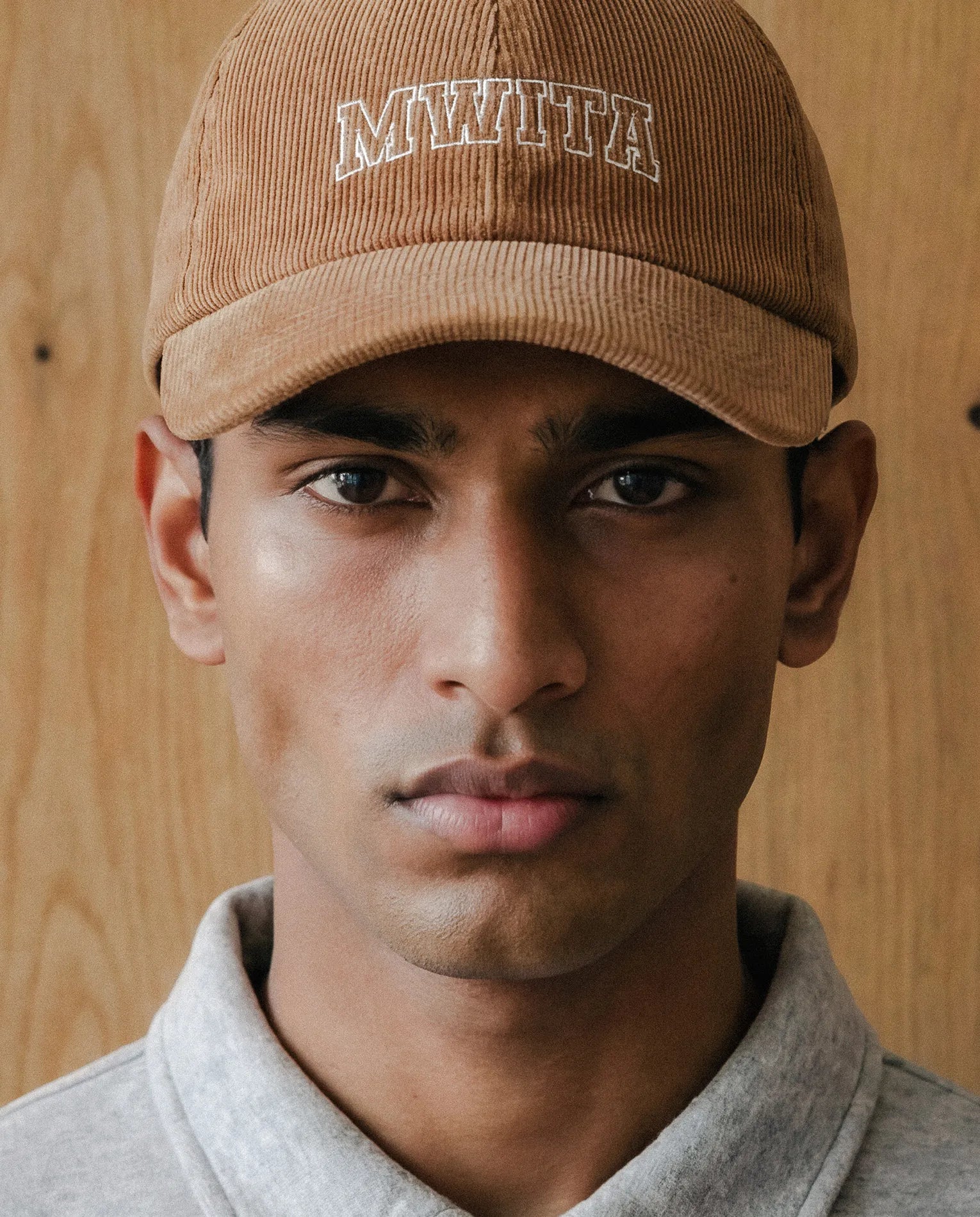 Model wearing SM Corduroy Cap