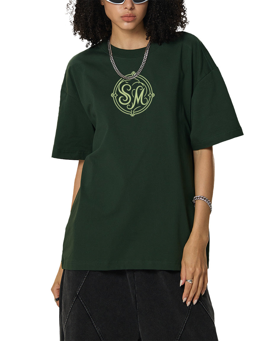 Model wearing SM Emblem T-shirt green front