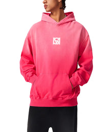 Model wearing SM Monkey Wash Hoodie pink facing sideways