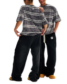Models wearing SM Sig. Snow Washed Stripe T-shirt and SM Fleece Straight Leg Trousers
