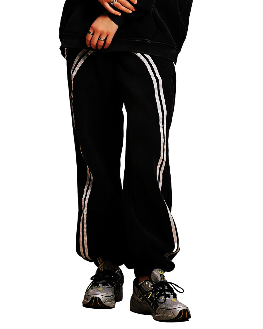 Model wearing SM Track Line Sweatpants front